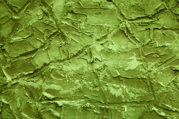 green background, photo shows texture of gray wall with different lines, strokes and cracks