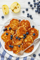 fried hot and crispy pancakes with blueberries