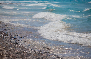 Waves crashing on a pebble beach