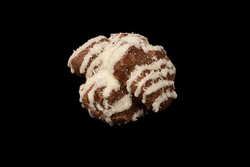 Profiteroles with coconut cream on a black background.