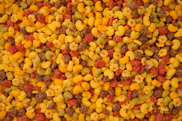 Sweet crunchy cornflakes as a background. Top view.