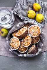 Freshly baked apple muffins in a grey basket