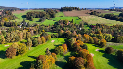 Drone view of autumn golf course in Germany.