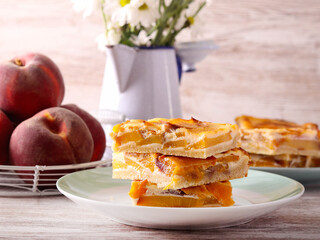 Peach cream  slices stacked on plate