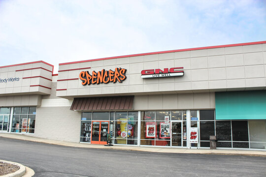 Wausau, WI, USA - August 17, 2025: Spencer's and GNC Live Well storefronts in Wausau. Several businesses are conveniently located in the Rib Mountain Drive area. For Editorial Use Only.