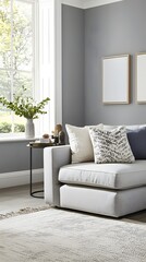 Cozy living room with gray walls, modern decor, and natural light
