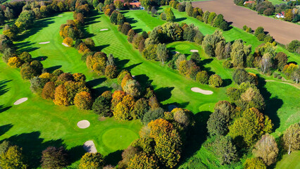 Drone view of autumn golf course in Germany.
