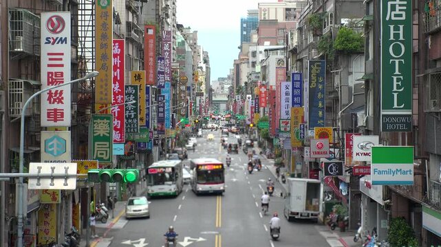 TAIPEI, TAIWAN - AUGUST 2019 : Scenery of street traffic at Datong District. Cityscape of old historical buildings, advertisement billboards of shops and stores along the road.