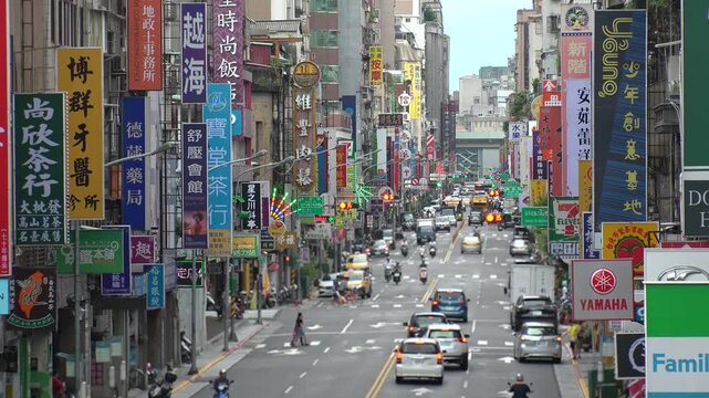 TAIPEI, TAIWAN - AUGUST 2019 : Scenery of street traffic at Datong District. Cityscape of old historical buildings, advertisement billboards of shops and stores along the road.