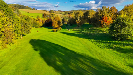 Obraz premium Drone view of autumn golf course in Germany.