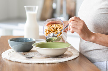 Woman Pouring Cereal