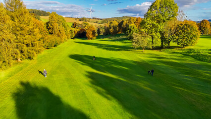 Drone view of autumn golf course in Germany.