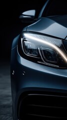 Stunning photo of closeup view of car front headlight showcasing modern design and highend automotive craftsmanship against a dark background.