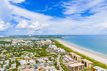Cape Canaveral Beach with distant view of rocket launch complex. Visiting the beach is a great way...
