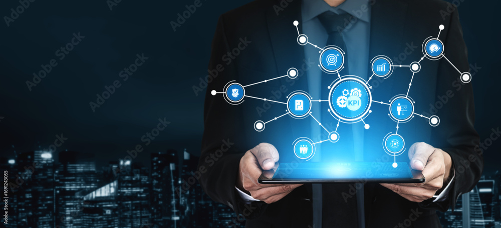 Poster a businessman in a suit holds a tablet displaying a digital network of key performance indicators, r