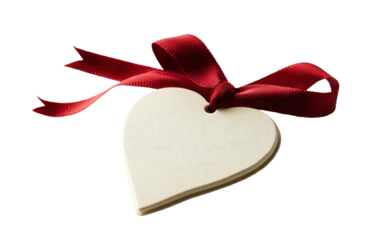 Heart shaped tag with festive red ribbon for valentine's day or anniversary gift