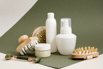 cosmetics for massage and personal care, face and body massage concept, various massagers made of natural materials and cosmetic containers