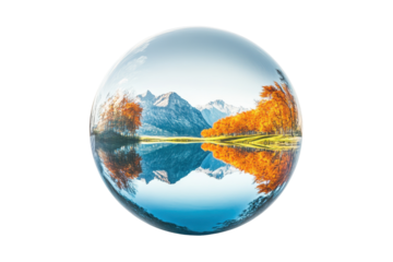Sunset over the field with barren trees reflected on water surface inside a crystal ball against white background, conceptual and dreamy