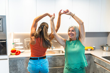 Joyful kitchen dance celebrating family moments