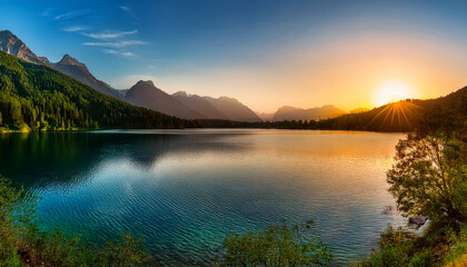 Tranquil Sunset Over Serene Lake With Lush Mountains And Soft Ribbons Of Water Reflecting Vibrant Colors In A Peaceful Nature Landscape