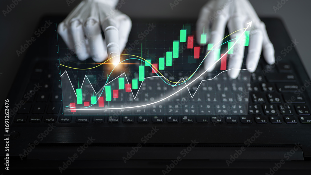 Poster hands interact with stock market data displayed on a laptop, symbolizing the fusion of technology an