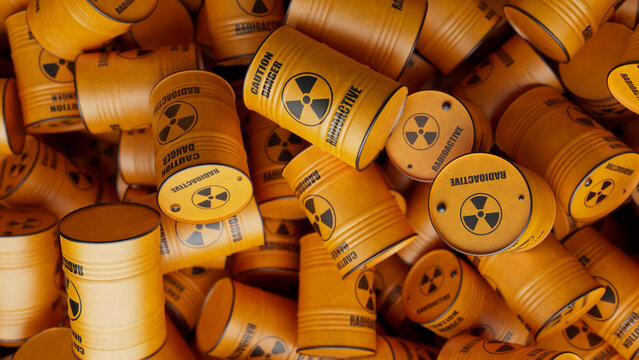 Numerous yellow barrels containing radioactive materials are stacked haphazardly, creating a visual representation of potential environmental disaster and the dangers of nuclear waste