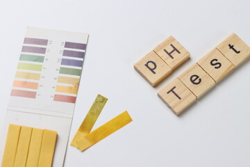 pH test strips in a white background with copy space