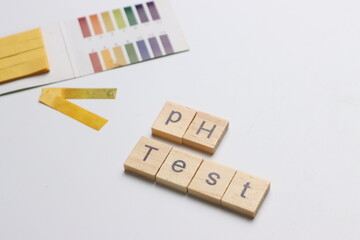 pH test strips in a white background with copy space