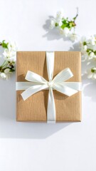 Gift box with white ribbon and spring blossoms