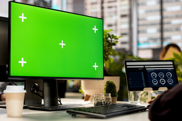 Middle eastern man studying infographics next to isolated copy space to help decision making, focused on project goals. Executive analyst managing administrative tasks and reviewing data.