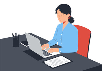 Young professional woman diligently working on her laptop at a modern office desk, showcasing productivity and remote work concept