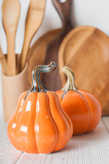 Autumn Kitchen Decor with Wooden Utensils and Ceramic Pumpkins
