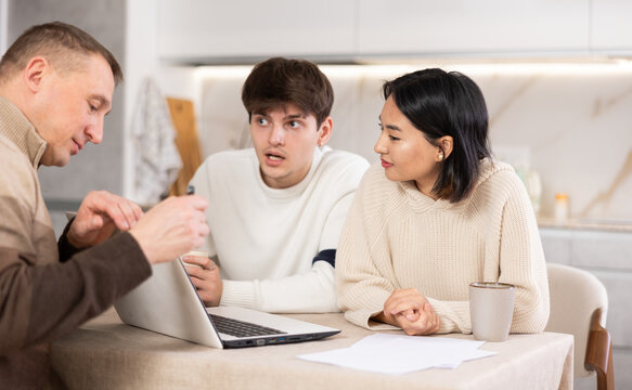 Experienced male agent offers to issue an insurance policy or take out a financial loan for spouses at home