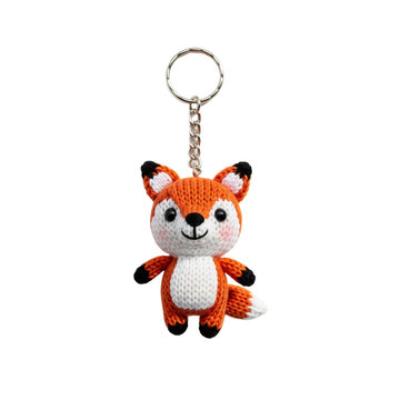A cute, handmade crochet fox keychain with orange and white colors. The fox has a smiling face and is attached to a metal keyring. Transparent background.