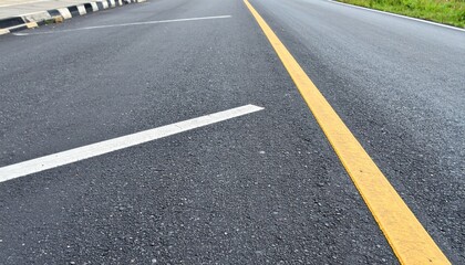 Asphalt Road Surface with Yellow and White Lane Markings