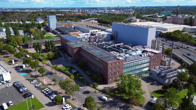 razor factory in Berlin producing cosmetics. Dramatic aerial view flight drone