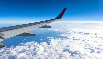 Obraz premium High-altitude view of clouds and wing