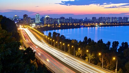 Fototapeta premium City highway at twilight over a river
