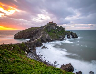 Dramatic sunset over a rocky island with a small chapel
