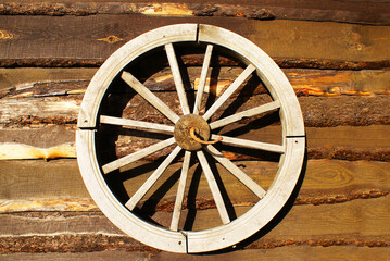 Wooden wheel, wood texture, log house, background, wooden planks, design.