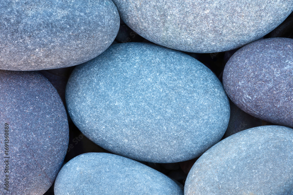 Poster pebbles stones on seashore as texture background for design of web banner template page. many stones