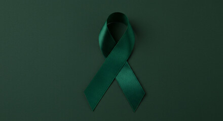 An emerald green ribbon on a dark green background serves as a symbol of hope and support