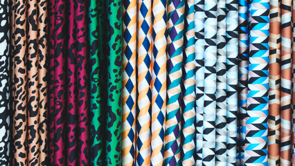 Row of colorful fabric with a variety of patterns.