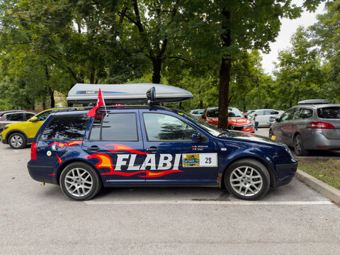 Ljubljana, Slovenia &ndash; 24.08.2025: Decorated Volkswagen station wagon with Carbage Run 2025 rally stickers and team names parked on the street during the Summer Edition of the European banger rally.