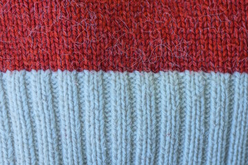 white red woolen texture of a sweater fabric with a striped pattern