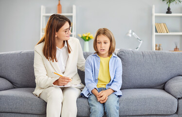 Helping child, female psychologist kind care, professional comforting asking teen boy, giving...