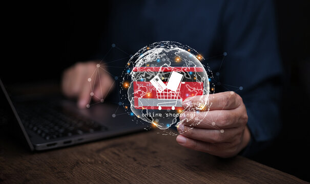 Global online shopping concept with digital world, shopping cart, credit card, and laptop, symbolizing e-commerce, international retail, and secure digital payment.