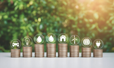 Invest in green future stacks of coins showing sustainable living icons like cars and wind turbines