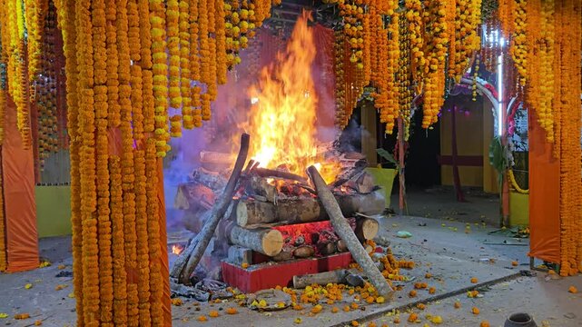 Sacred fire ritual Yajna or Yagna, Hindu puja ceremony with havan, Spiritual worship with holy fire, Traditional Indian religious ritual stock video footage.