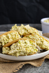 Venezuelan arepa Reina Pepiada stuffed with shredded chicken and creamy avocado. Authentic Latin street food with traditional homemade flavor